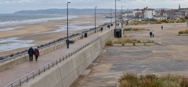 AI-generated coastal regeneration illustration, inspired by Rhyl; not a photograph of the site or an approved redevelopment design.