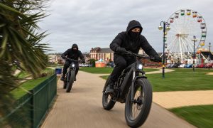 AI generated image of two young people on e-bikes