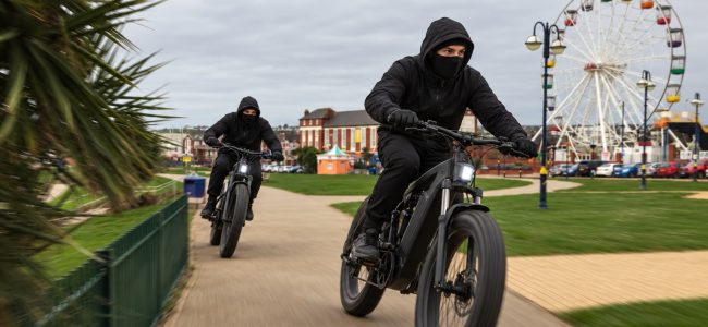 AI generated image of two young people on e-bikes